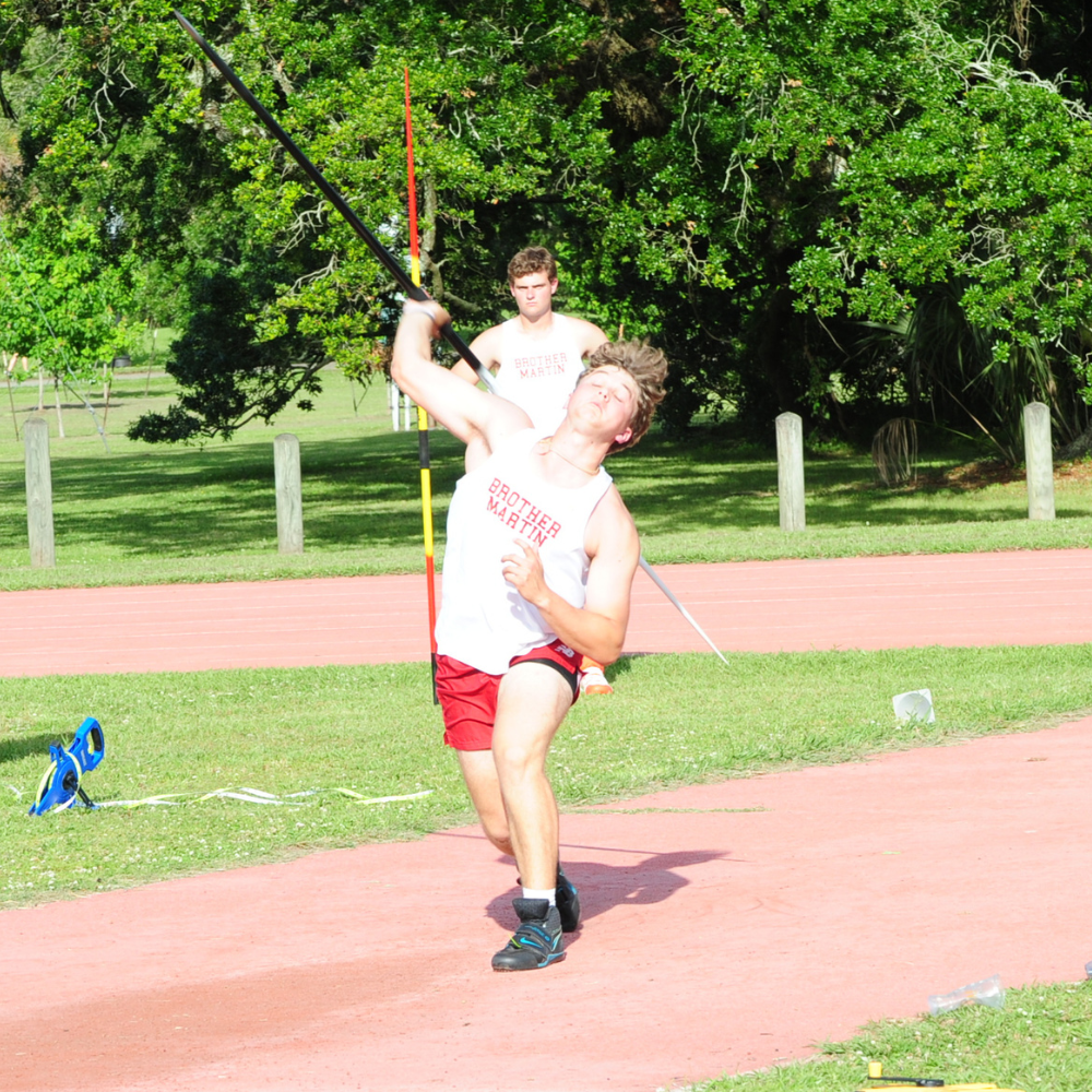 Brady Allen gets off a javelin throw of 163- feet, 2 inches against a strong wind. His best throw placed him second in the event.